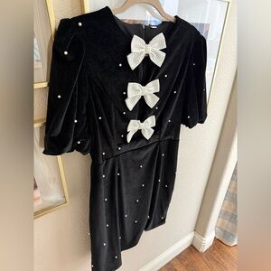 Elegant Black Dress with Pearl Bow Accents